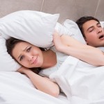 Woman having trouble with husband snoring