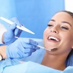 Picture of adult woman having a visit at the dentist's
