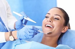 Picture of adult woman having a visit at the dentist's